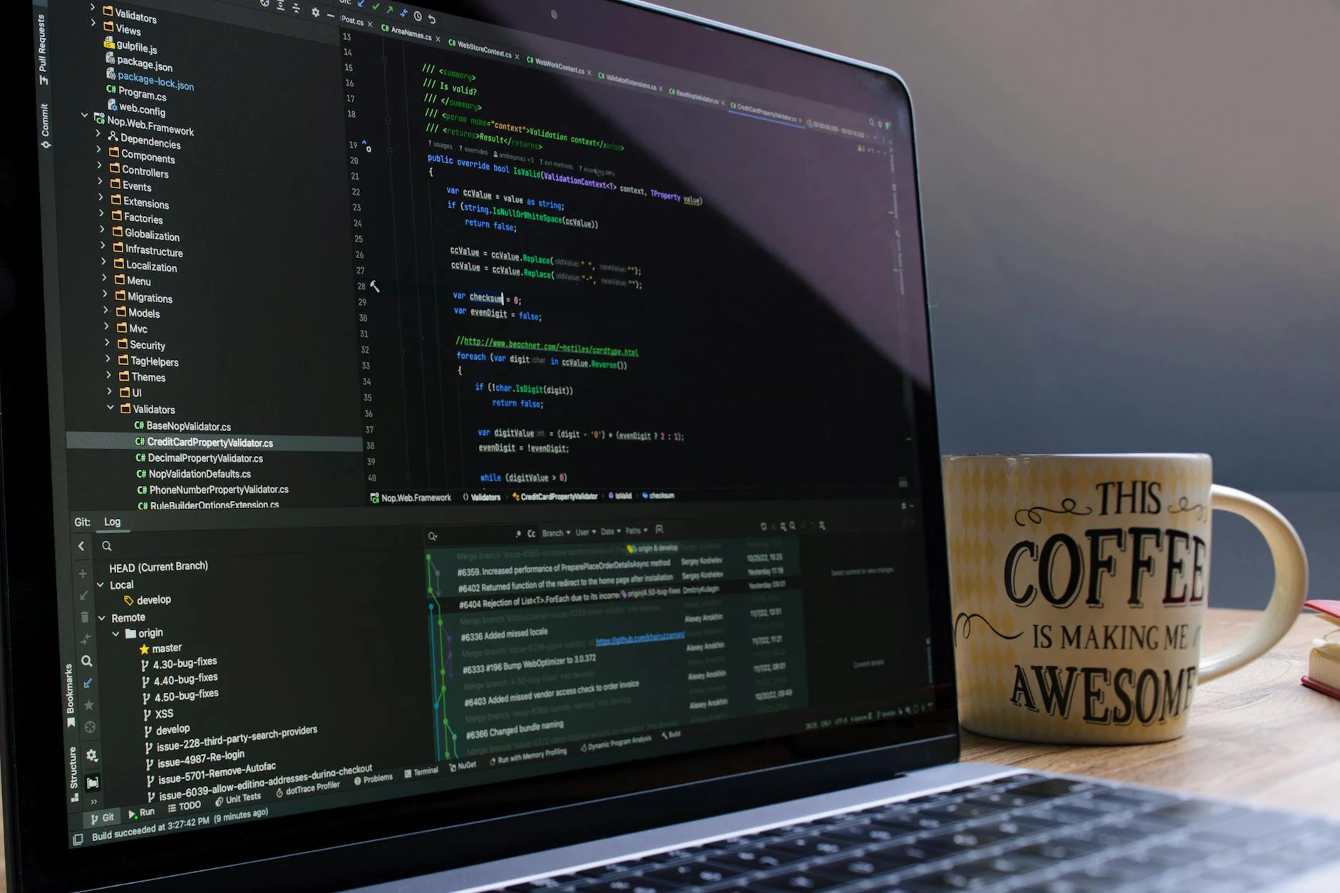 Developer reviewing AI-generated code on a workstation with multiple monitors