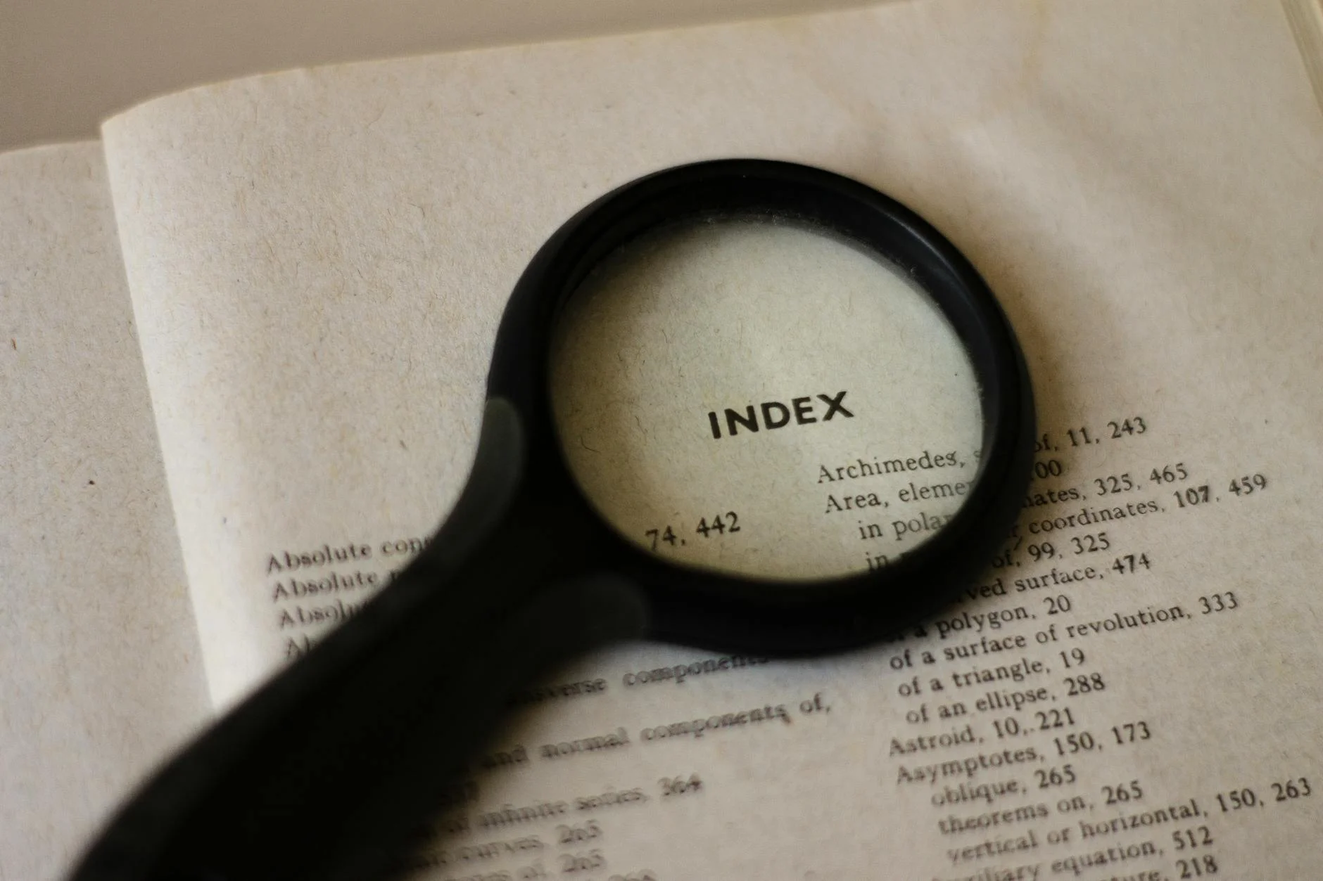 Magnifying glass placed over a printed document page