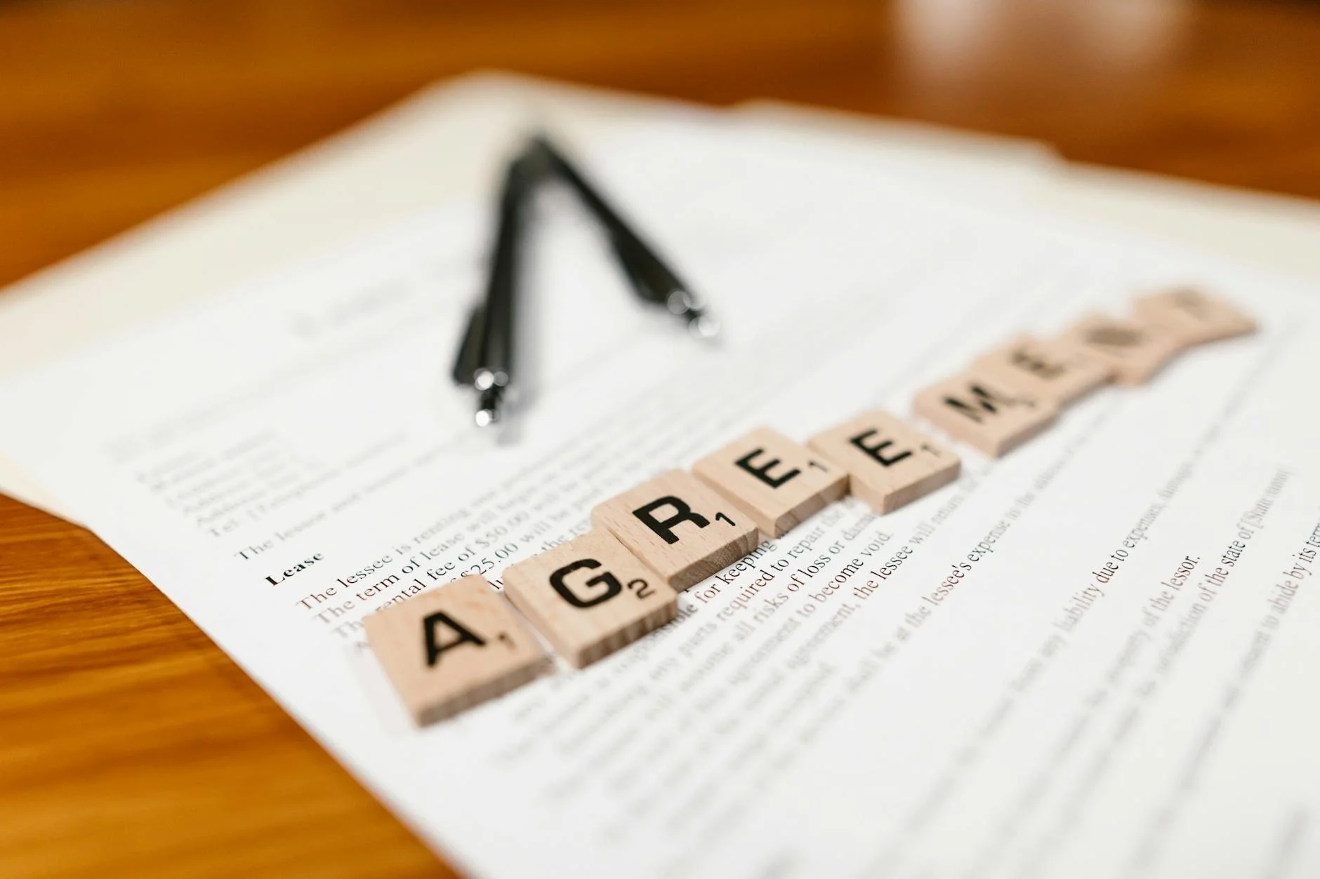 Business contracts and documents stacked on a desk