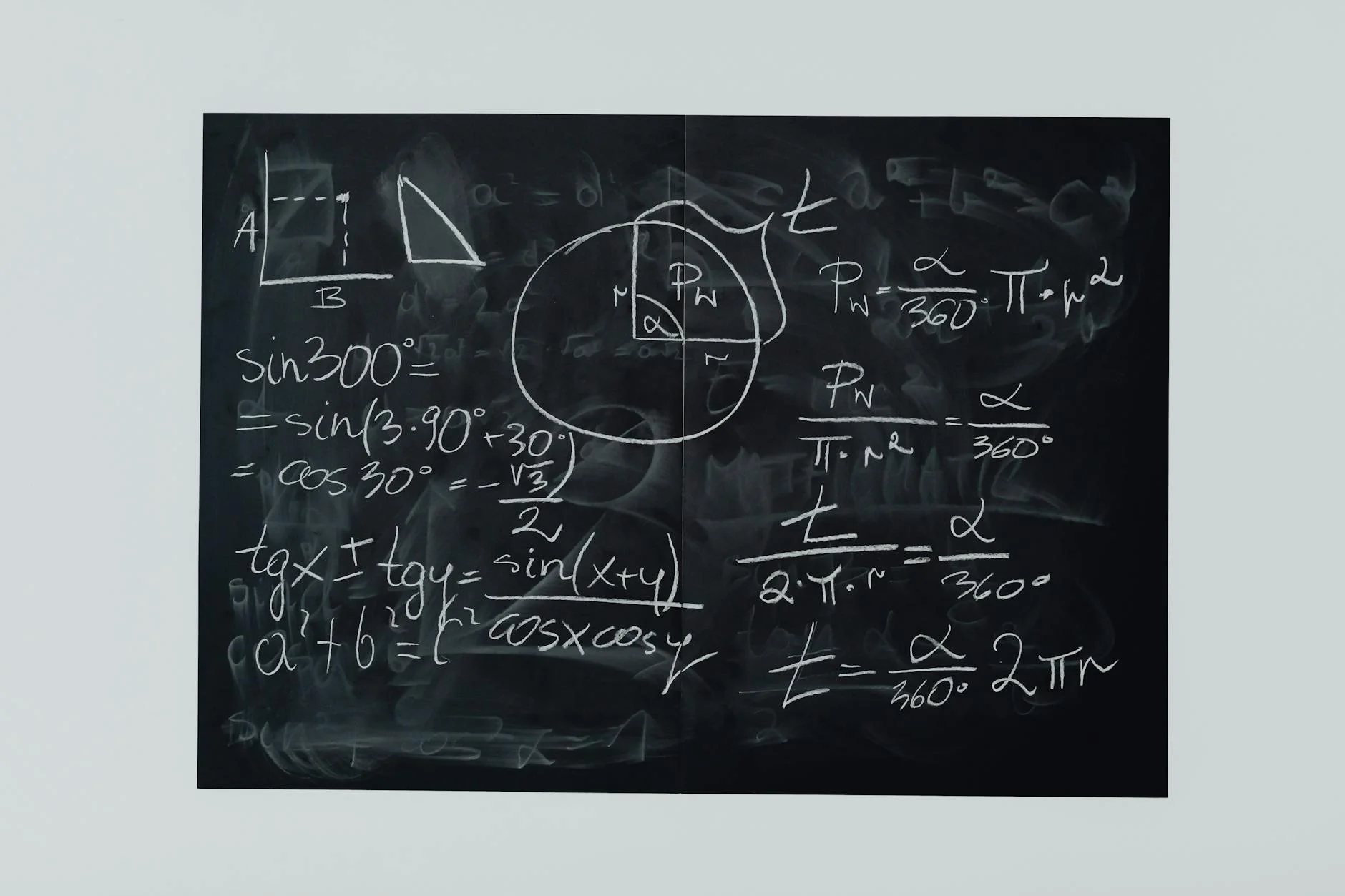 Handwritten mathematical formulas on a chalkboard