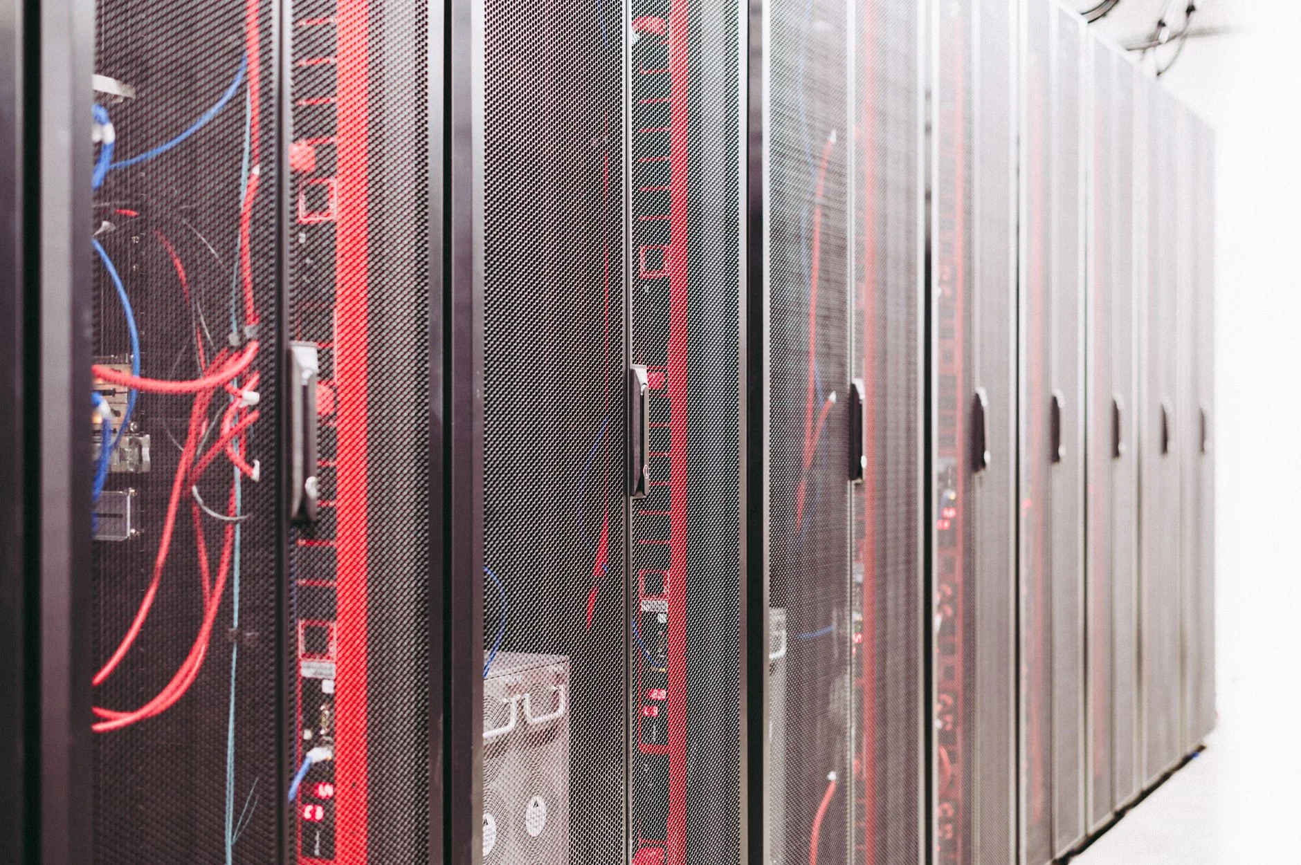 A row of server racks with neatly organized cables in a data center