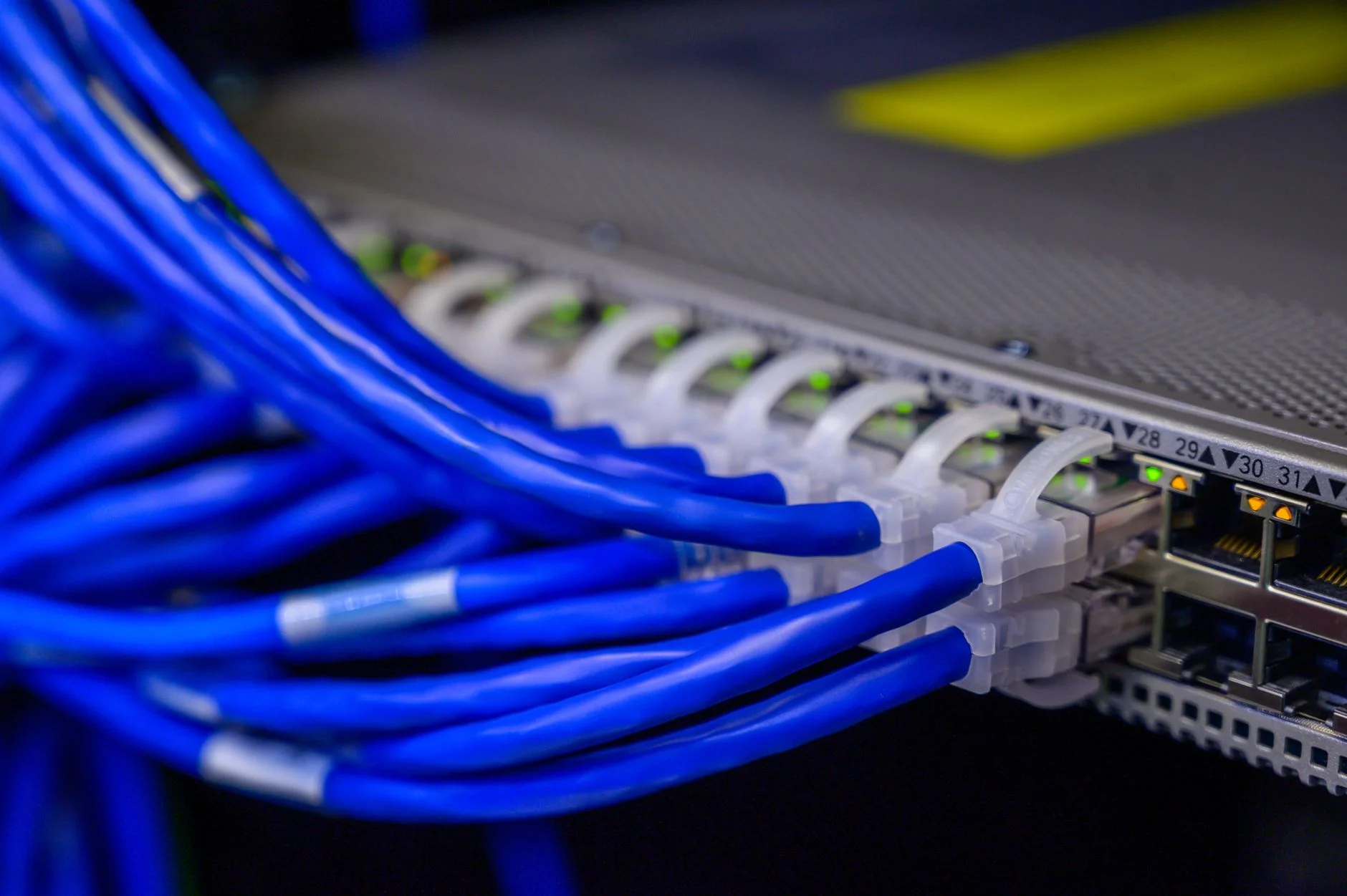 A neatly organized server rack with bundled cables in a data center