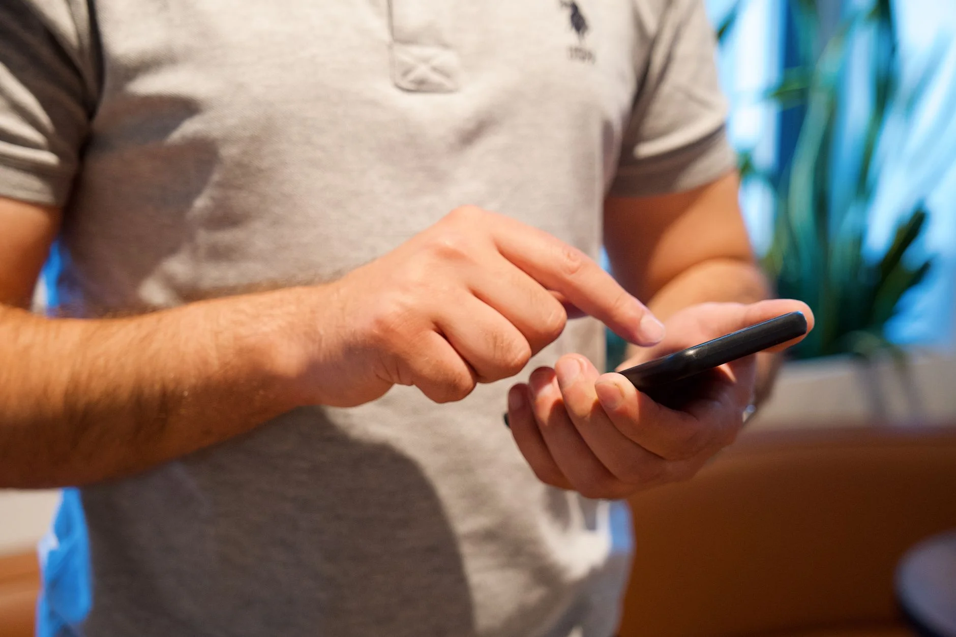 A smartphone displaying a clean sign-up screen on a desk