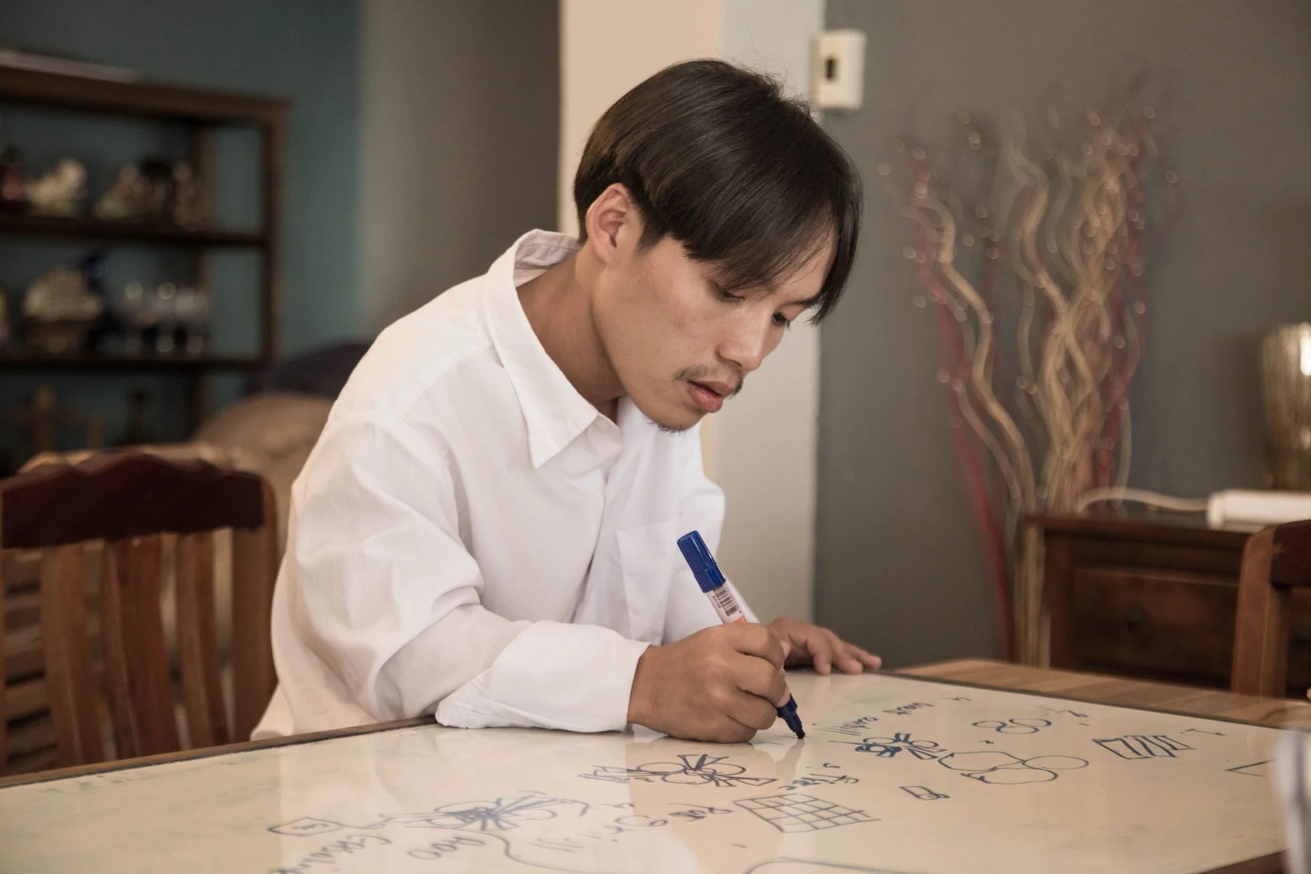 A whiteboard covered in sketches and annotations from a design session