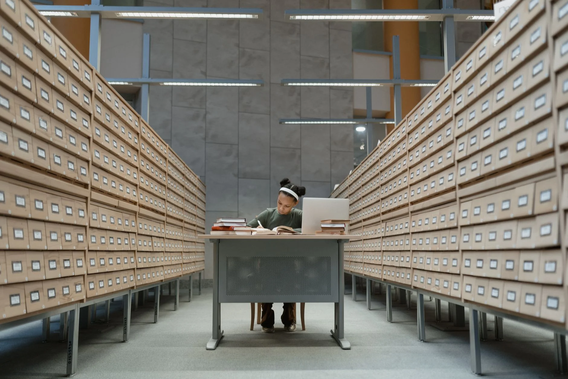 rows of library card catalog drawers representing duplicate records