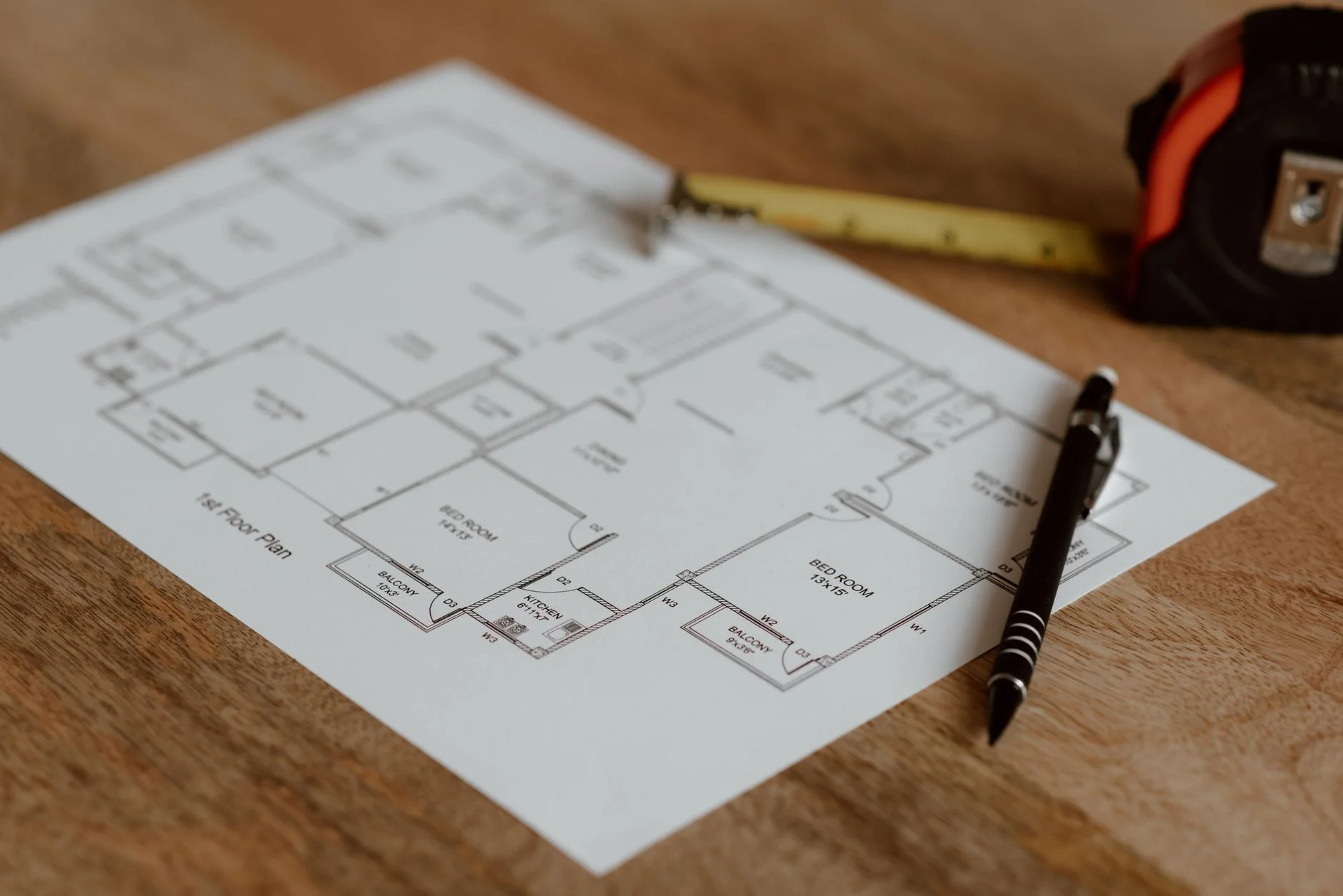 architectural blueprint with pencil and ruler representing planning before commitment