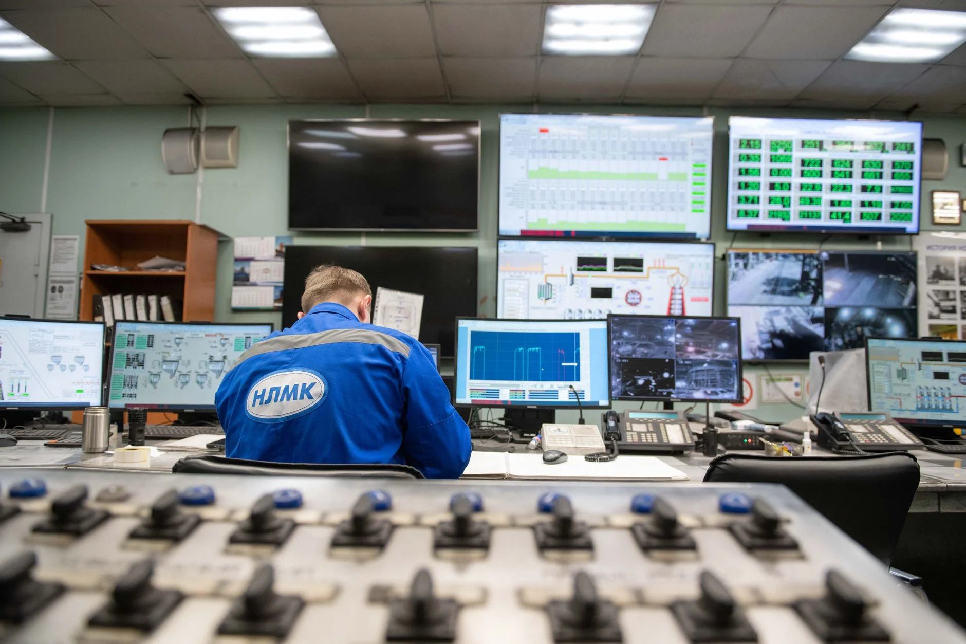 A network operations center with rows of monitors displaying live connection dashboards