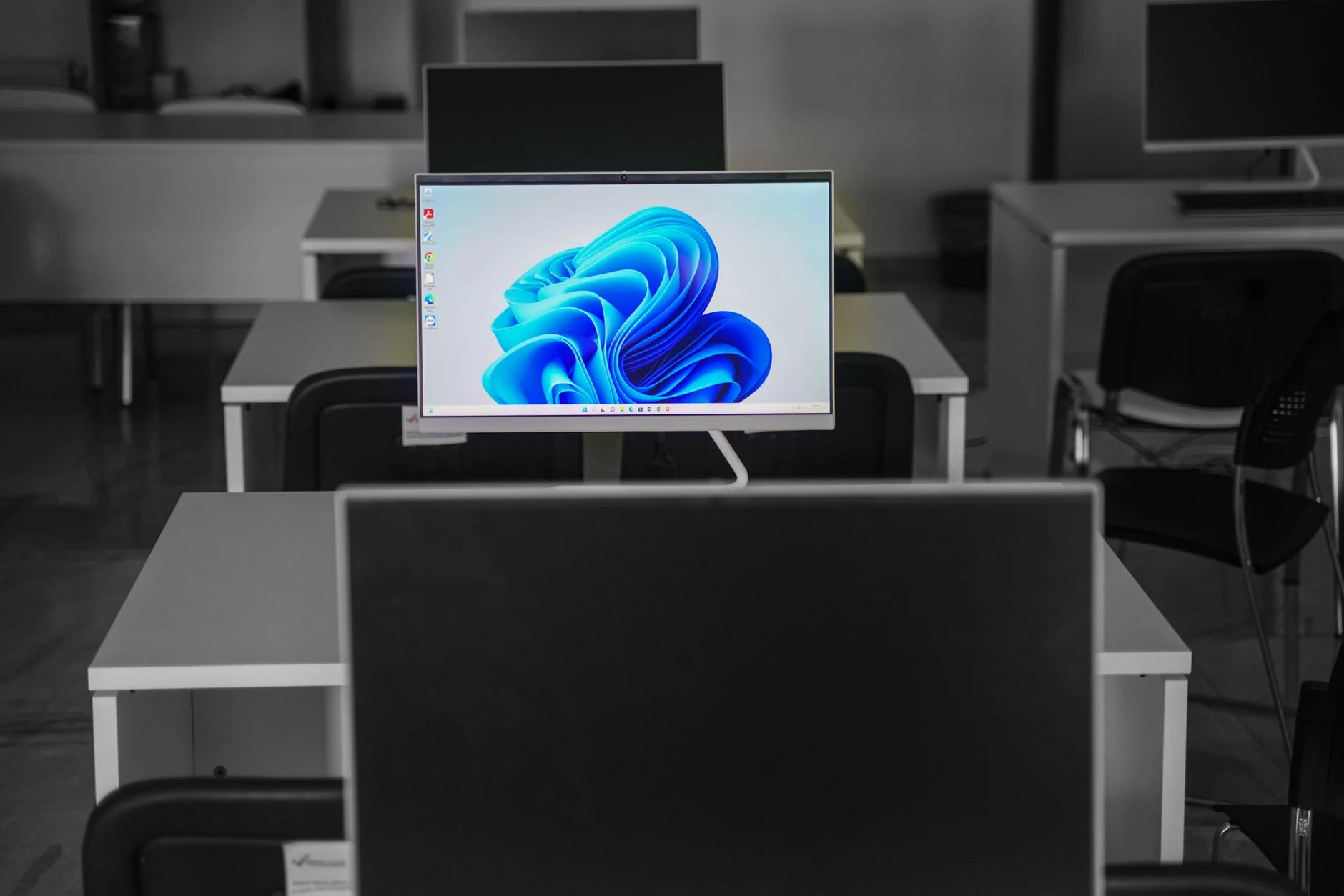 A network operations center with rows of monitoring screens