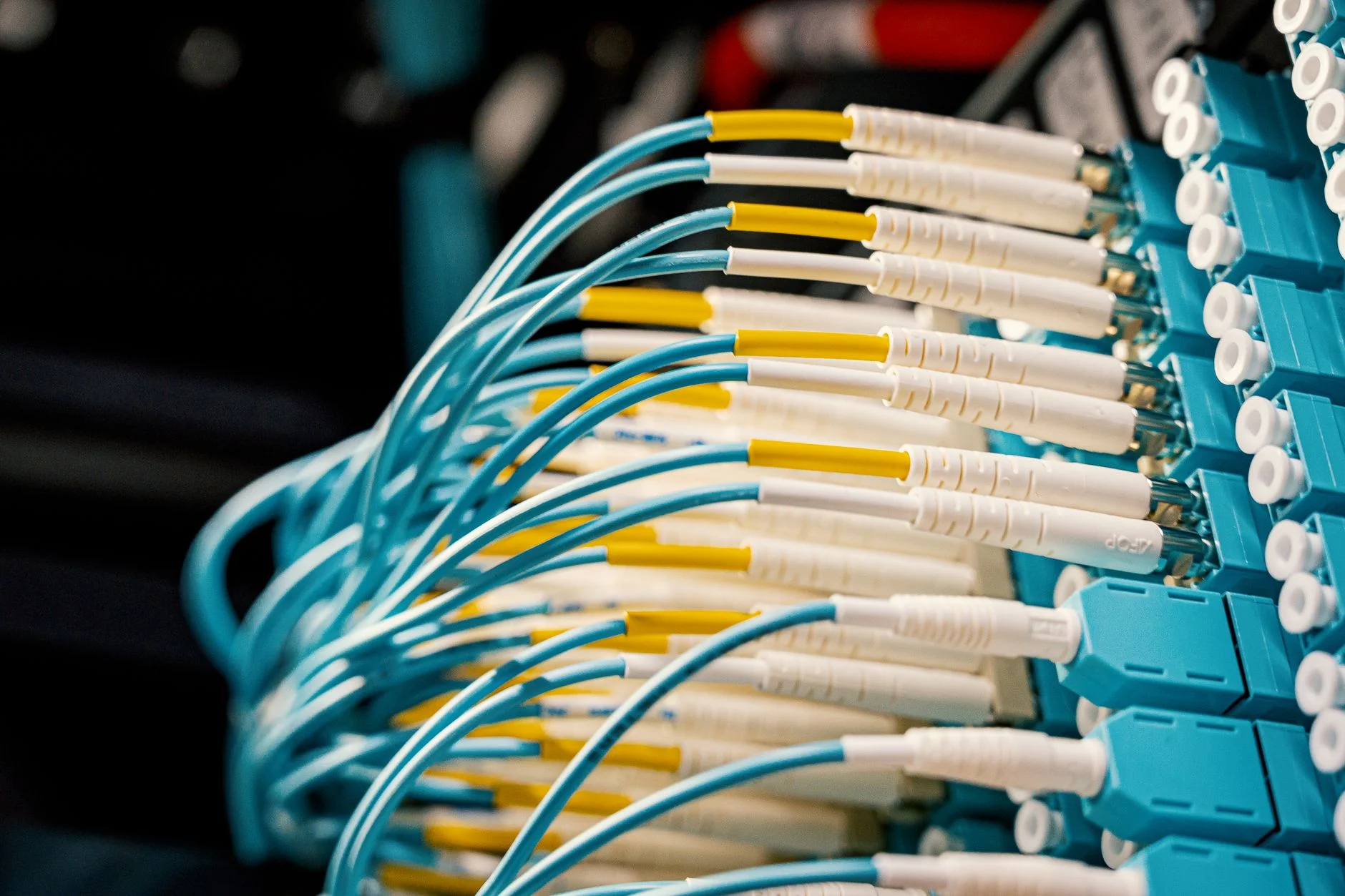 Glowing fiber optic light strands representing hidden business technology infrastructure