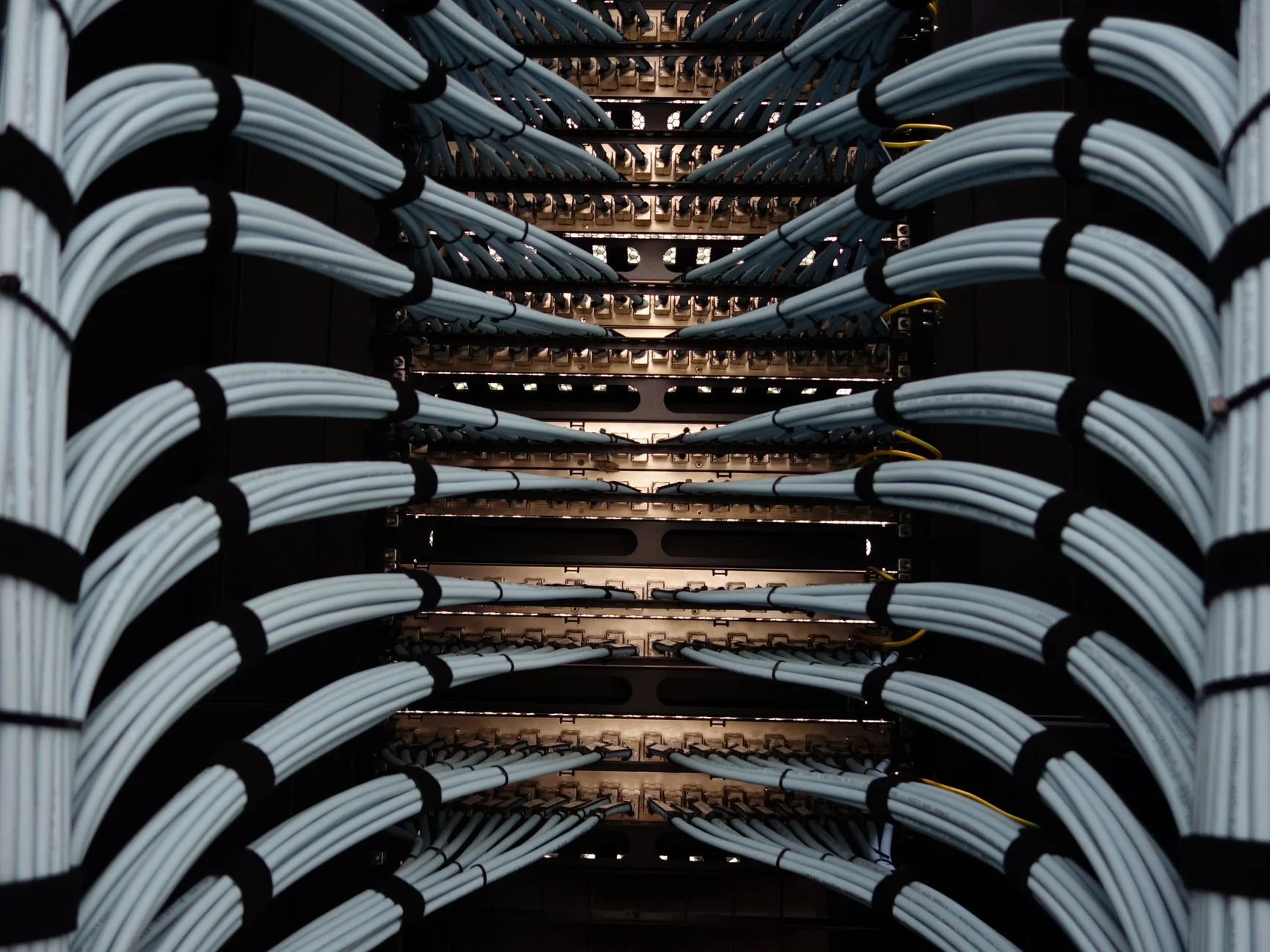 Server rack with organized cables representing a layered security policy