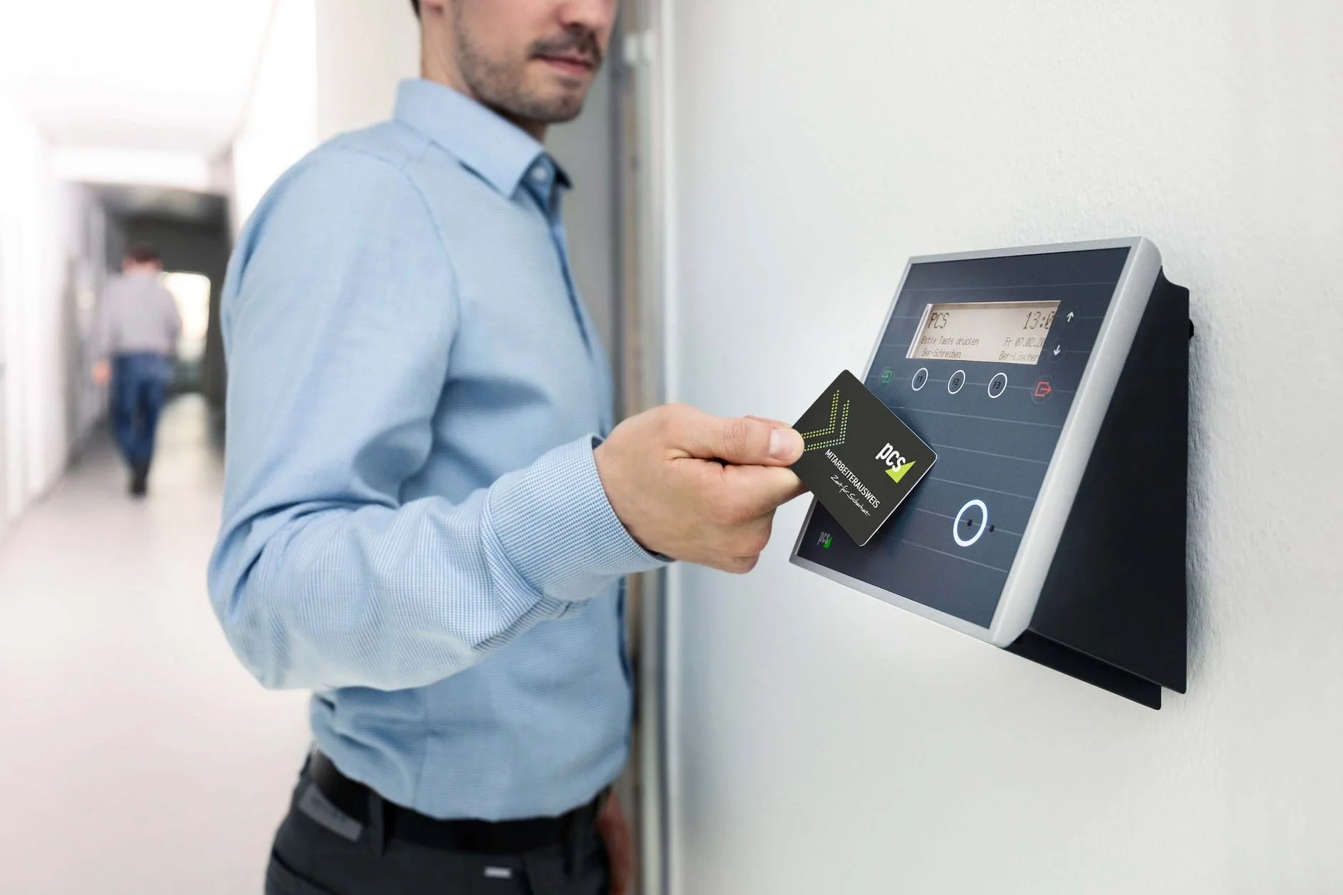 Close-up photo of a keycard being held near an electronic access reader